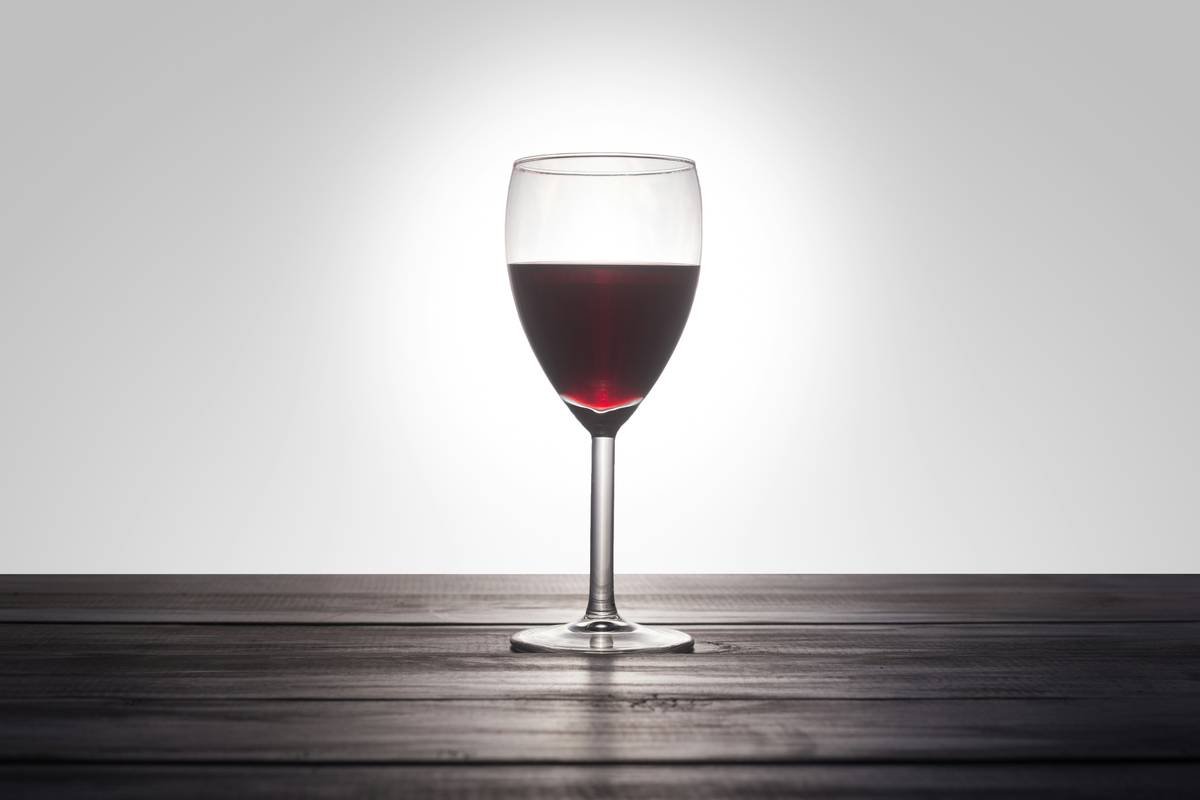 Infographic showing circular wine production: grapes → wine + pomace → compost for soil OR upcycled into organic skincare products