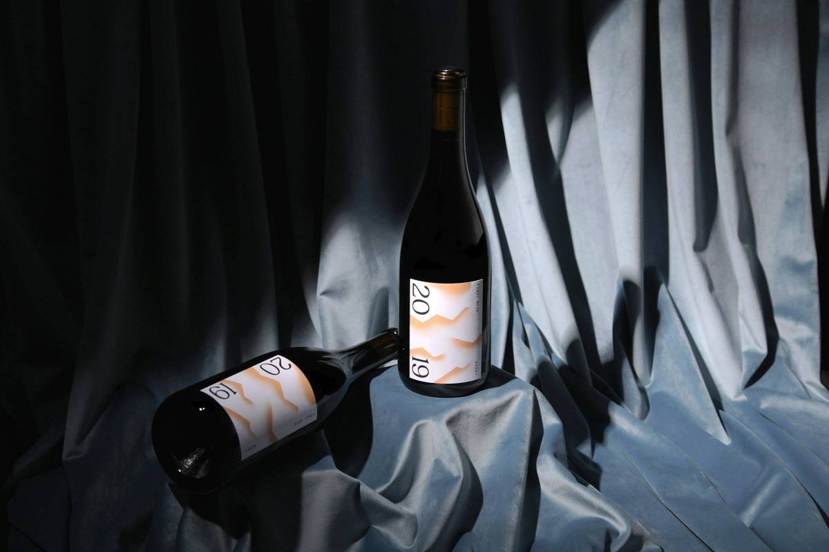 Woman enjoying honest-ingredient wine drinks with clear labeling and fresh ingredients